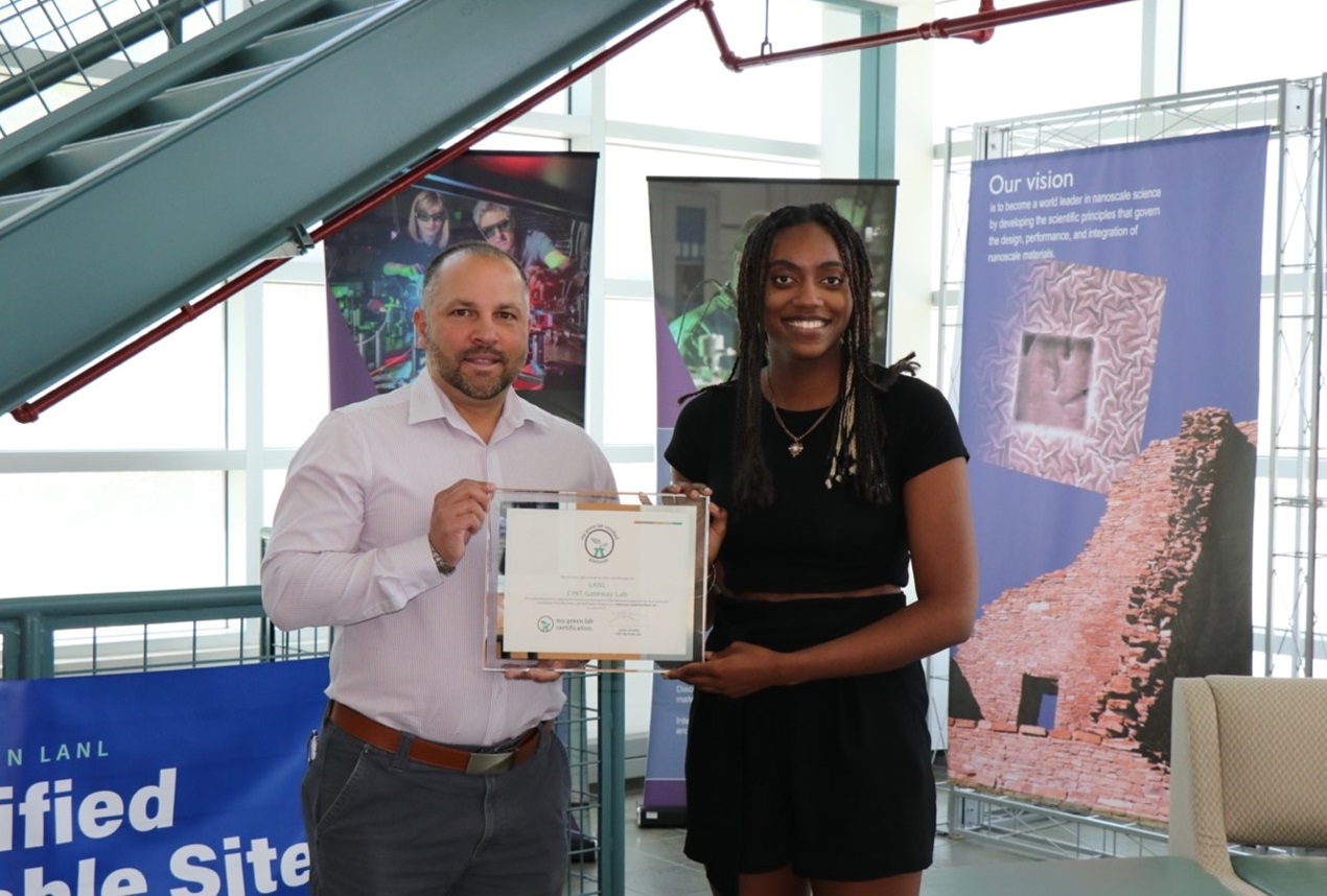 Ricardo Martí-Arbona (left) and CINT student Camari Knox (MPA-CINT) with CINT’s “My Green Lab” platinum certification.